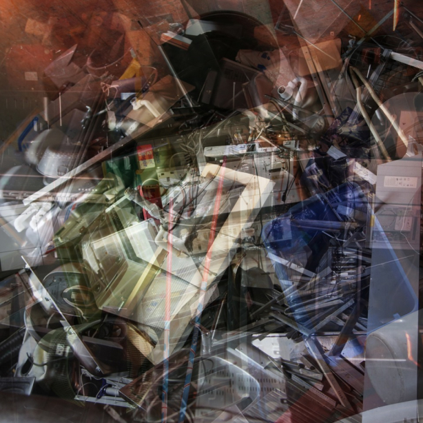 Picture of the motif "wertstoff" by Markus Heinsdorff. The multi-exposure photo shows a collection of discarded items in containers. On closer inspection, several layers of different objects can be seen, from electronic waste to metal rods and seat cushions.