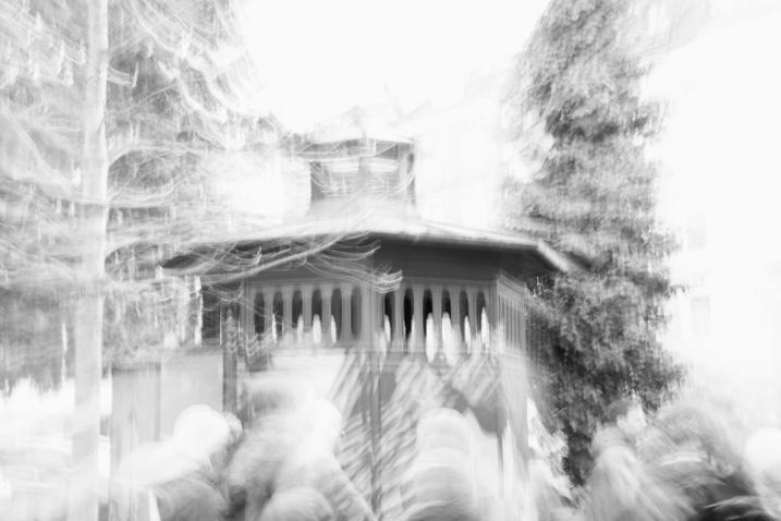 The blurry image shows the roof of a toilet cubicle. It is black and white and blurred.